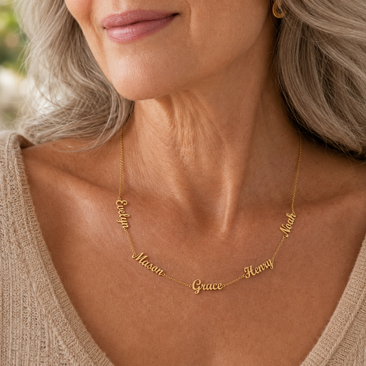 Gold | grandmother wearing five name necklace with her grandchildren's names