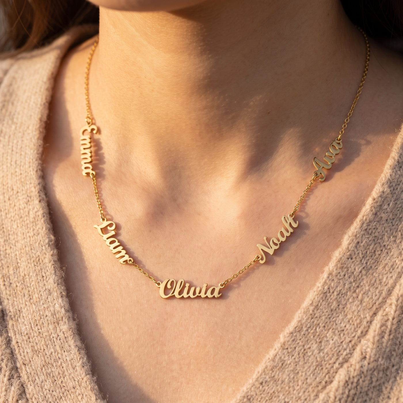 Personalized family name necklace shown in gold, rose gold and silver finishes