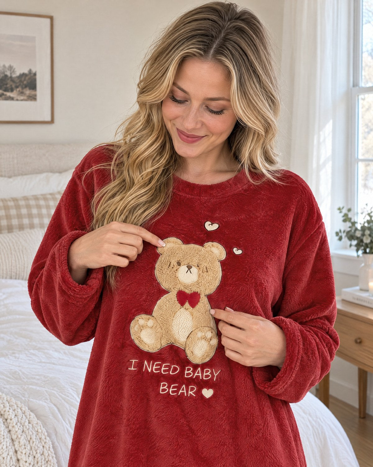 Woman pointing at the teddy bear on her Bear Hug Fleece Nightgown