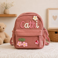 Dusty rose corduroy backpack with hand knitted name Cathi