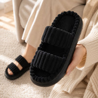 Black | held in hand showing plush texture