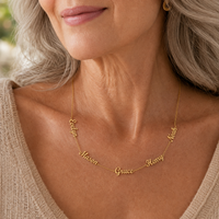 Gold | grandmother wearing five name necklace with her grandchildren's names