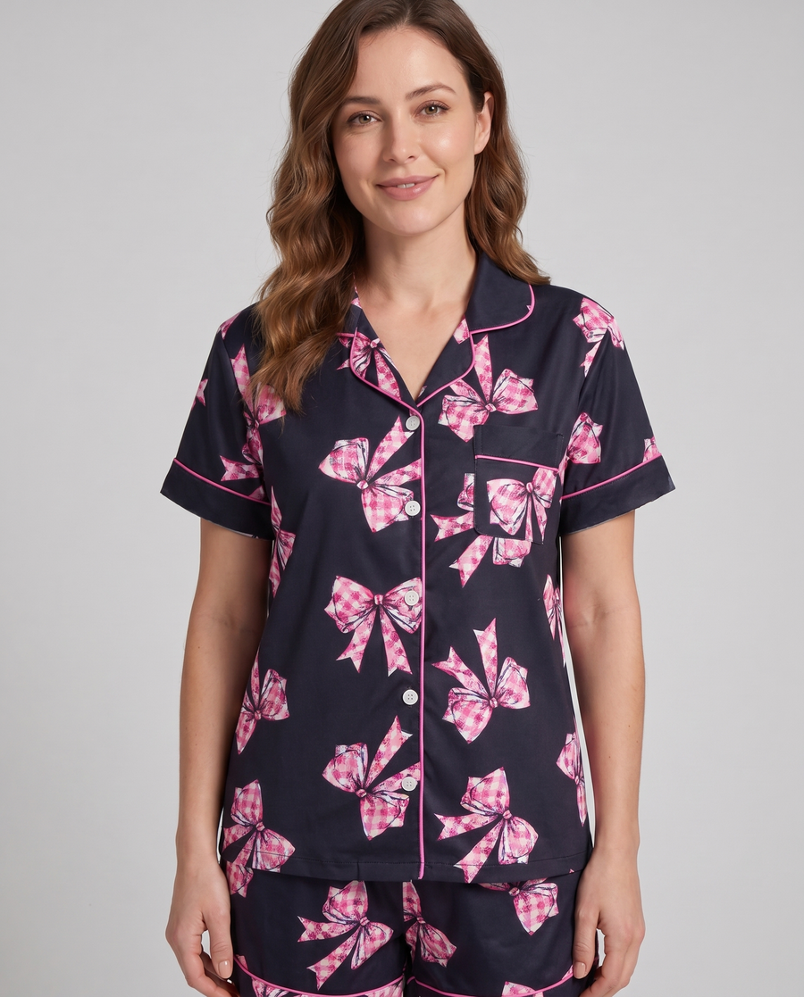 Black ribbon pajama shorts on model — relaxed-fit elastic waistband, lounge ready