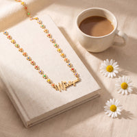 Gold | styled flower name necklace with coffee and daisies