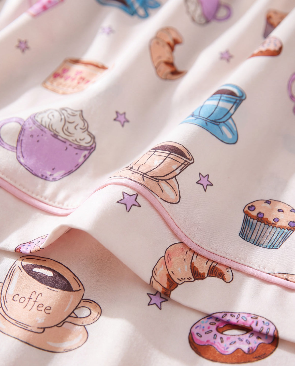Close-up of the coffee, croissant and donut print fabric