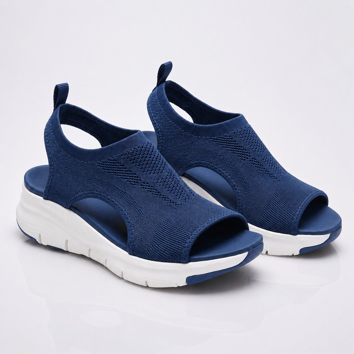 Cloudstep Comfort Sandal in navy — breathable airknit pair with white cushioned platform sole, studio view