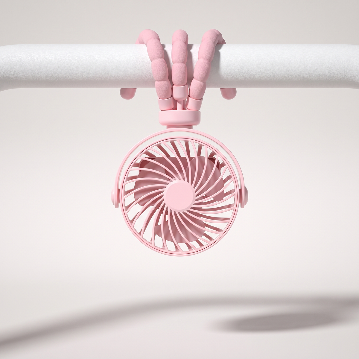BreezyBuddy 360 Stroller Fan — Pink, legs wrapped around stroller bar