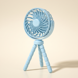 BreezyBuddy 360 Stroller Fan — Blue, standing on flexible tripod legs