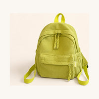 Green corduroy backpack, plain, before the name is knitted on