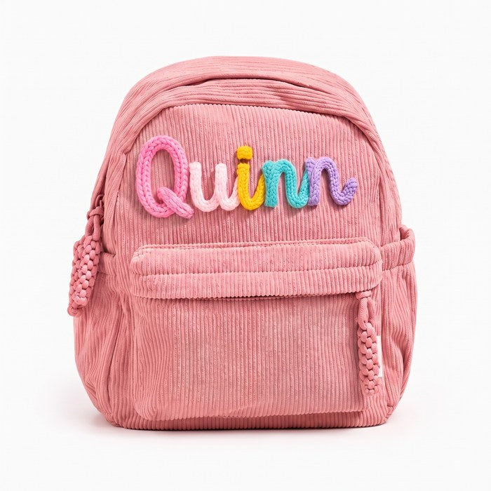 Quinn backpack, letters knitted in Bubblegum A15 · Blush A16 · Sunshine A20 · Dusty Blue A3 · Violet A36