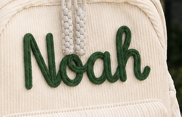 Signature script knitted lettering