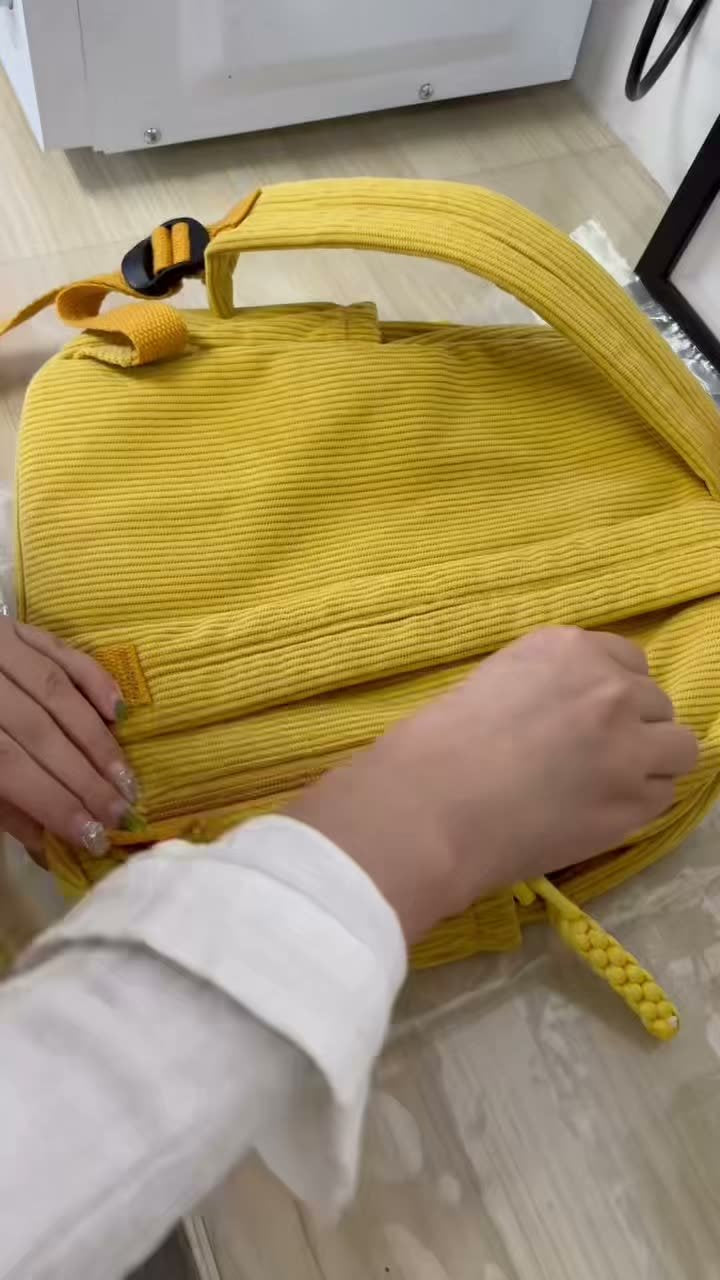 Customer video of a yellow personalized backpack