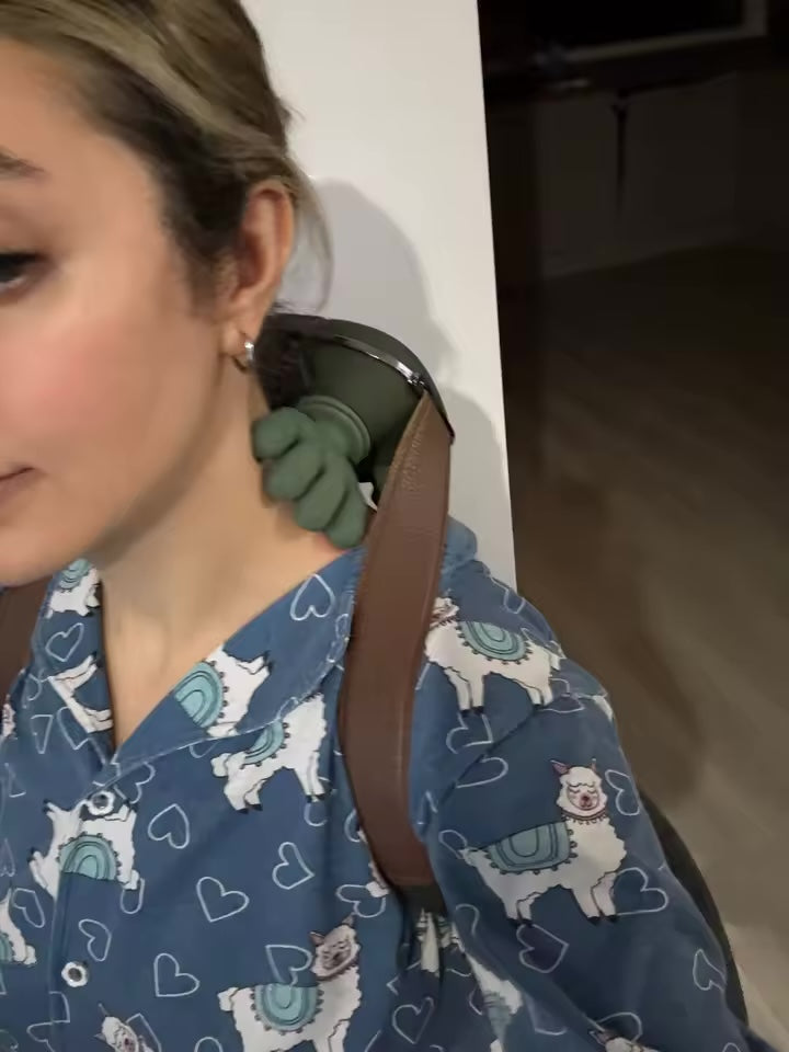Customer wearing KneadFlow on her neck in pajamas