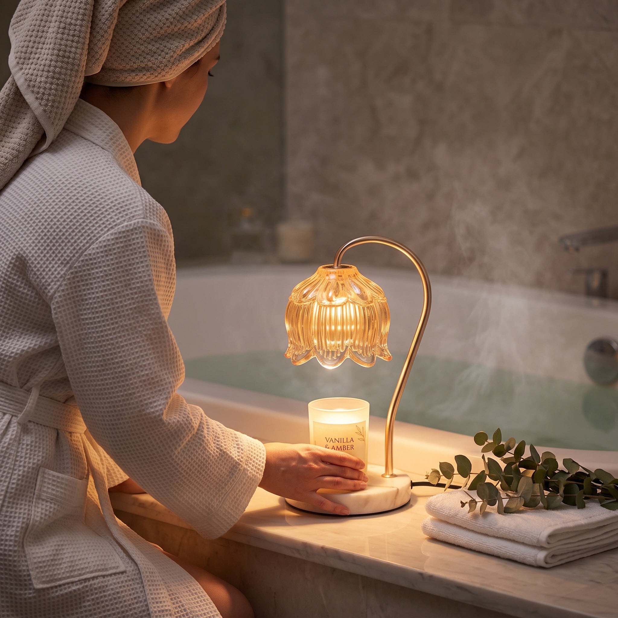 Woman setting the Marble Bloom candle warmer beside the bathtub