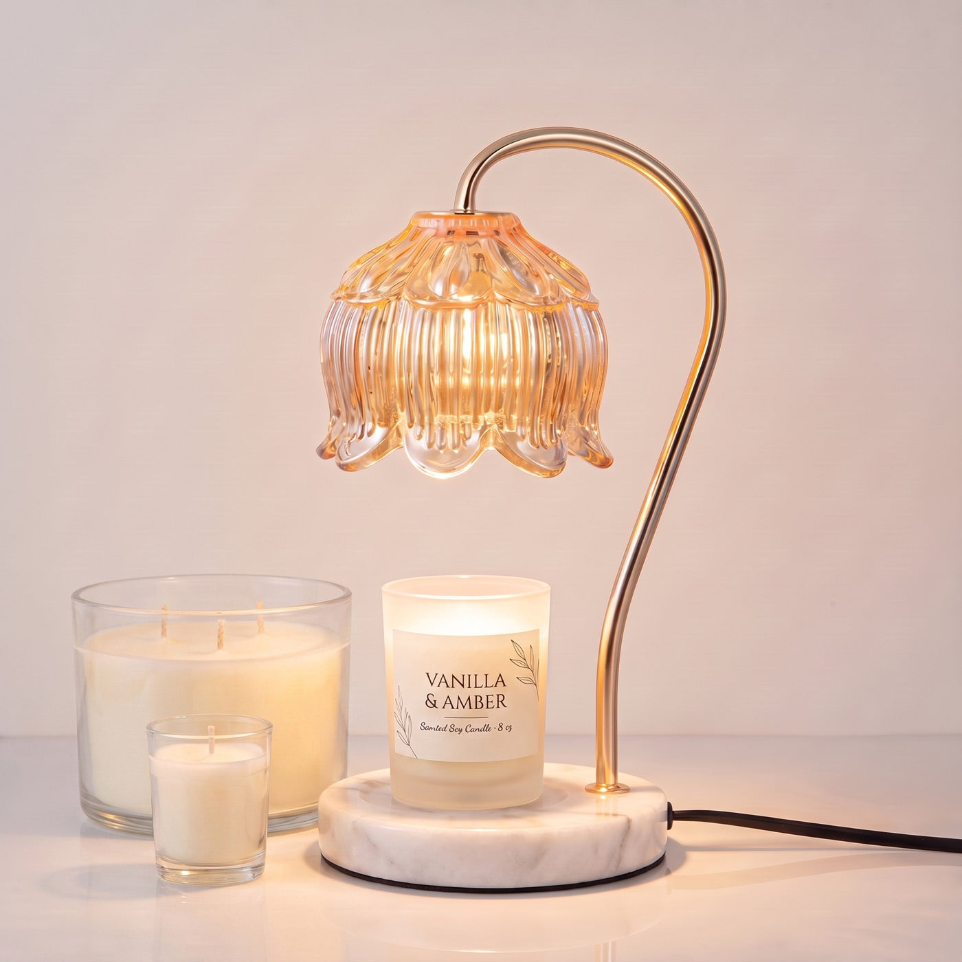 Three candle sizes shown fitting under the Marble Bloom shade, from votive to large three-wick